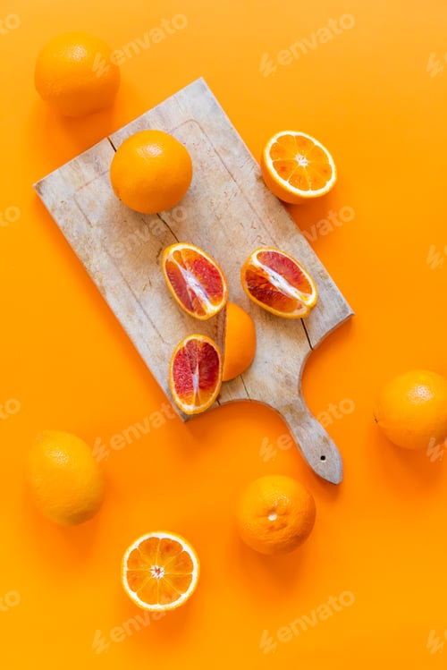 Preview: Fresh juicy oranges on colorful background