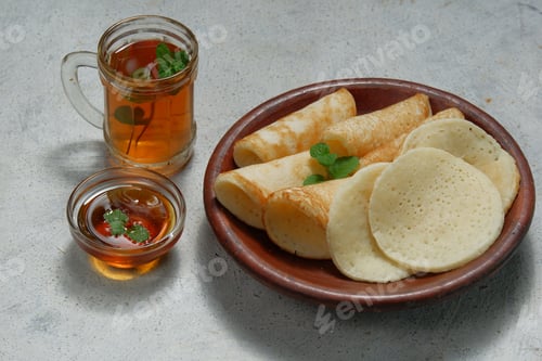 Preview: Moroccan pancakes, Arabic pancakes - Baghrir served with honey and mint tea