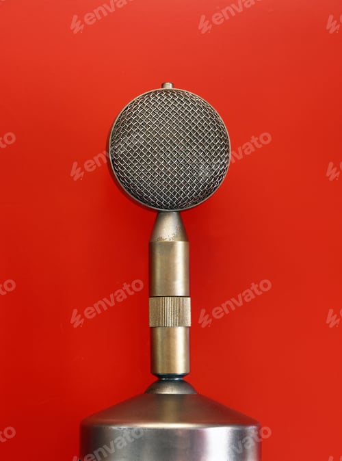 Preview: Vintage metal microphone over red