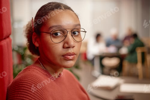 Preview: Portrait of Young Female Student Wearing Glasses