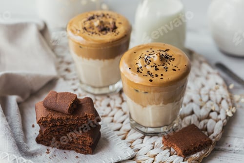 Preview: Glass of Iced Dalgona Coffee, trendy fluffy creamy whipped coffee and milk