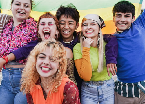 Preview: Group of happy young people having fun together during LGBT pride parade