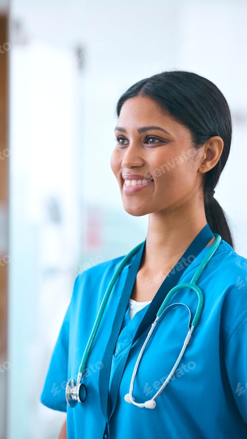 Preview: Portrait Of Smiling Female Doctor Or Nurse Wearing Scrubs And Stethoscope In Hospital