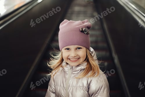 Preview: Joyful Girl Riding the Subway Escalator in a Bustling City
