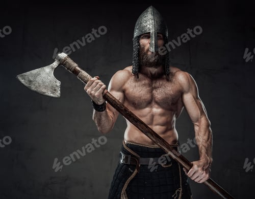 Preview: Muscular viking posing holding his axe in dark background