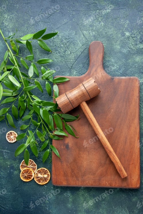 Preview: top view brown wooden desk with hammer on a dark-blue background color wood kitchen sharp brown