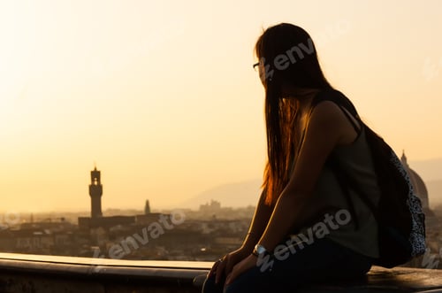 Preview: Teen at sunset watching the view of Florence.