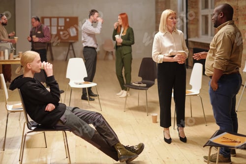 Preview: Relaxed people communicating after session