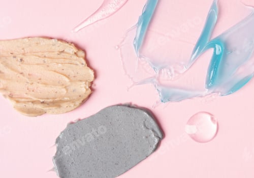 Preview: Multicolored samples of cosmetic products on a pink background