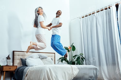 Preview: Cinematic image of an happy multiethnic senior couple.