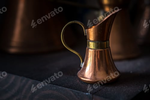 Preview: old copper milk jug for breakfast with coffee with dark background