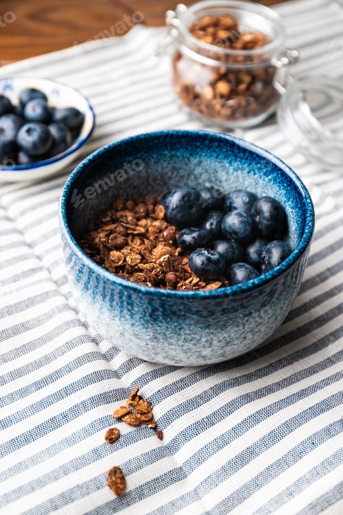 Preview: Granola with chocolate, nuts and fresh blueberries. Healthy and simple breakfast.