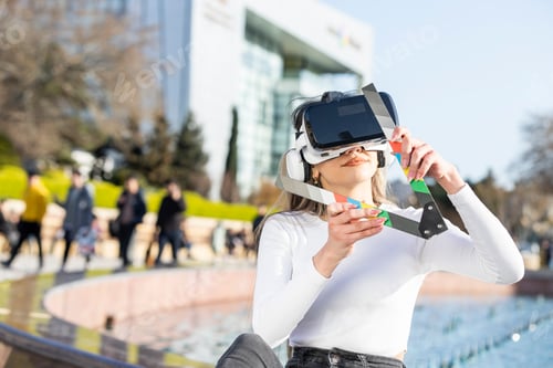 Preview: Young lady wears VR set and sitting on the street