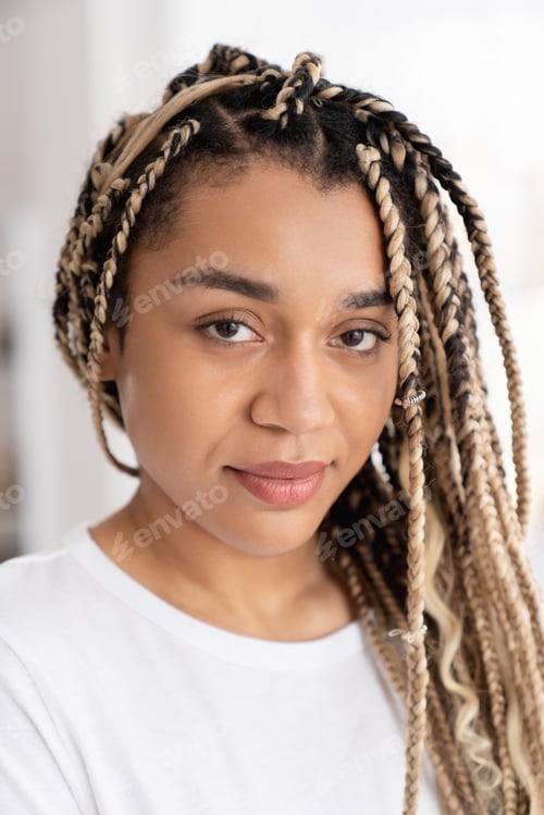 Preview: Close up portrait of a beautiful african-american young woman female in white T-shirt