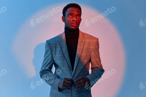 Preview: man wearing jacket african appearance cropped view neon background fashion
