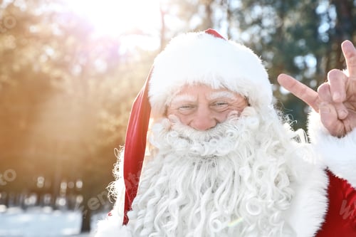 Preview: Happy Authentic Santa Claus showing rock gesture outdoors, space for text