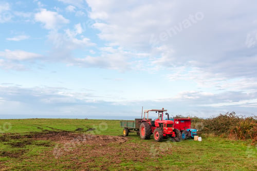 Preview: old tractors stopped after a day's work in the field.