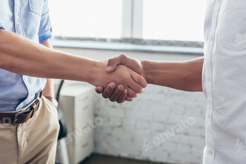 Preview: close-up partial view of business people shaking hands