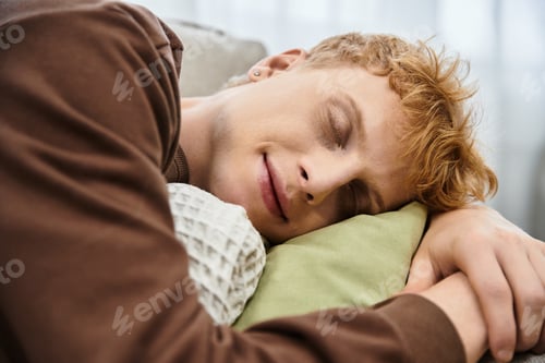 Preview: In a modern apartment, a handsome redhead man peacefully rests on his pillow.