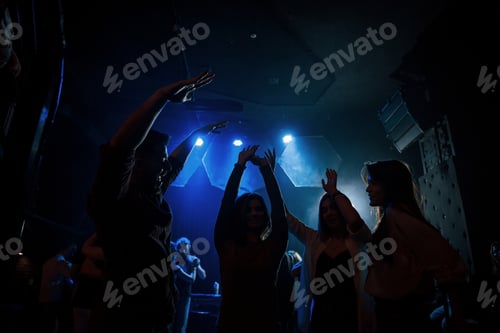 Preview: Group of people that enjoying dancing in the nightclub with beautiful lightings