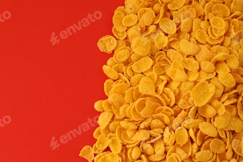 Preview: Background of breakfast cereals in big amount on red background, top view