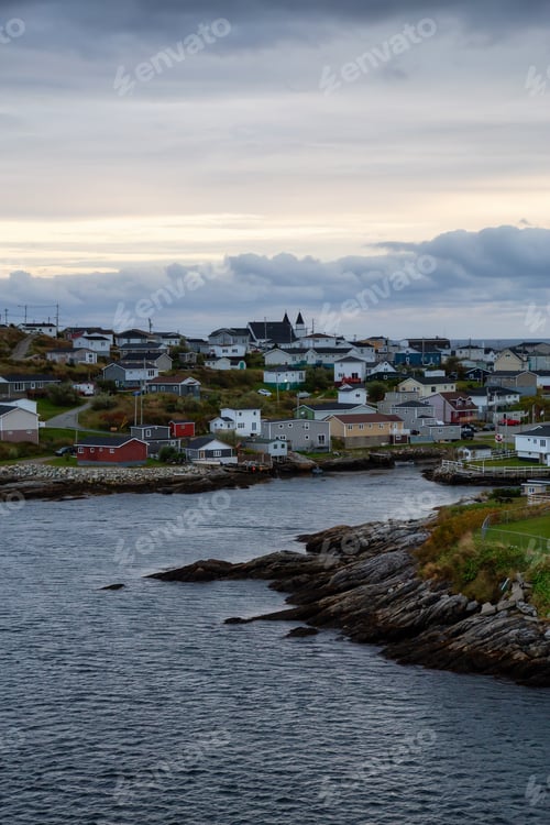 Preview: Homes in a little town on the rocky Atlantic Ocean Coast during a cloudy sunset