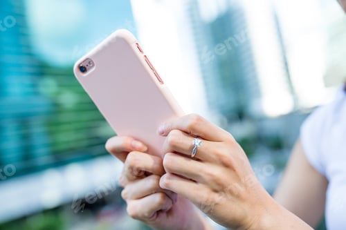 Preview: Woman using mobile phone