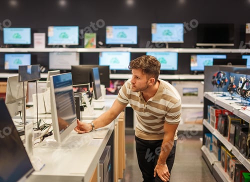 Preview: Man buying monitor in mall