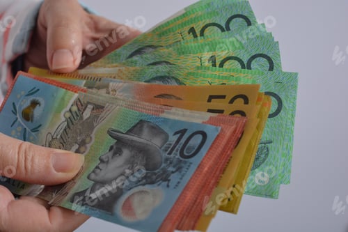 Preview: Banking and Finance : Australian banknotes, various dollar bills, in woman’s hands