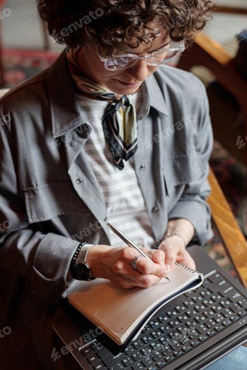 Preview: Young businesswoman or freelancer working over new project or preparing report