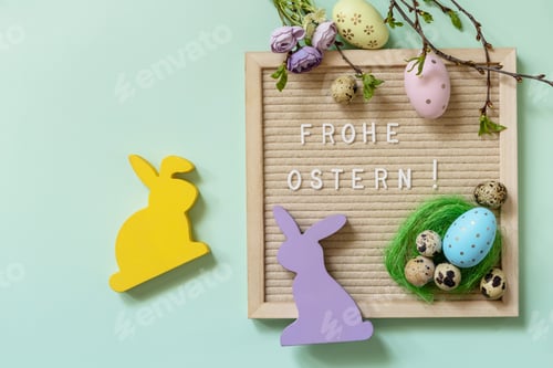 Preview: Happy Easter in german greeting, Easter eggs and green branches on a green background.