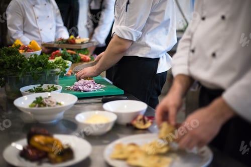 Preview: team cooks and chefs preparing meal