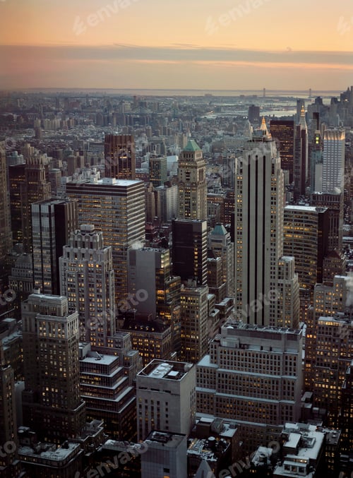 Preview: Aerial view of Snowy skyscrapers in city center at sunset