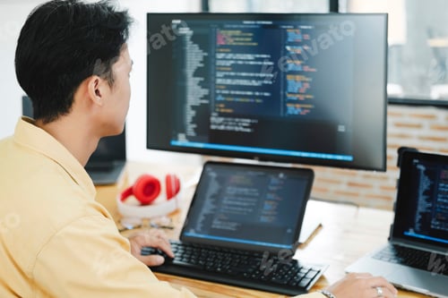 Preview: IT Programmer Starts Working on Desktop Computer.