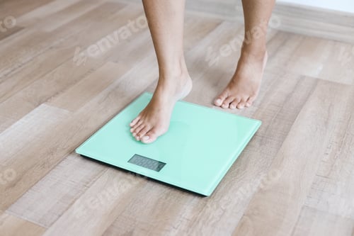 Preview: Woman Leg Stepping on Weigh Scales