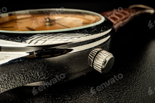 Preview: Old metal watch dial in dark macro photo