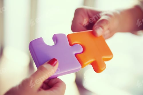 Preview: business people group assembling jigsaw puzzle