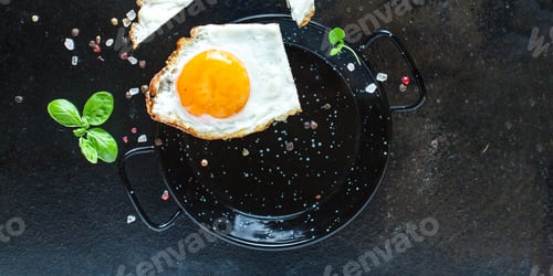 Preview: Fried Egg Scrambled Eggs White And Yolk Eat With Forks Meal On The Table Tasty Serving Size Portion