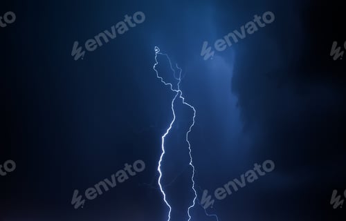 Preview: Lightning in the night sky. Thunderstorm over the city. Stormy clouds and rainy weather.