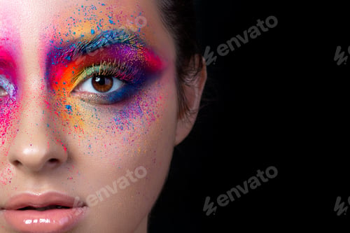 Preview: Close up view of face with multicolored makeup