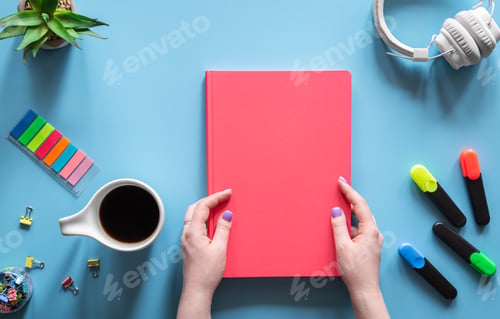 Preview: Flat lay composition on the theme of school and study with a pink notebook.