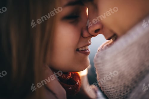 Preview: Closeup portrait of young couple face to face