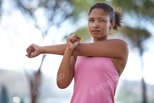 Preview: Making sure her muscles are ready for the run. A young teenager warming up for the run ahead.
