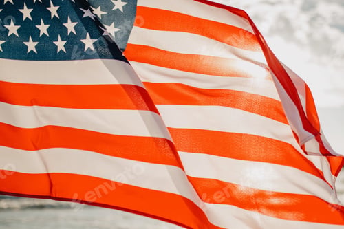 Preview: Usa national America flag at seaside background as symbol of democracy us memorial day 4th of july