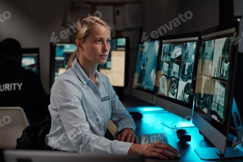 Preview: Blond female security guard in uniform