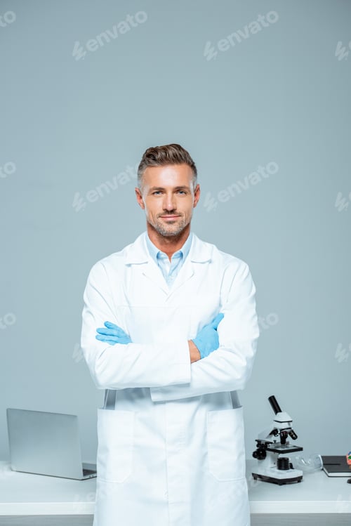 Confident Scientist in Lab Coat with Arms Crossed