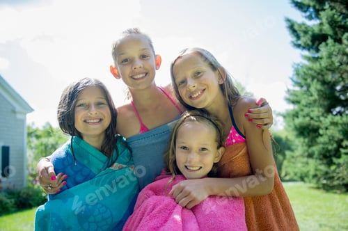 Preview: Girls in swimming costume wrapped in towels