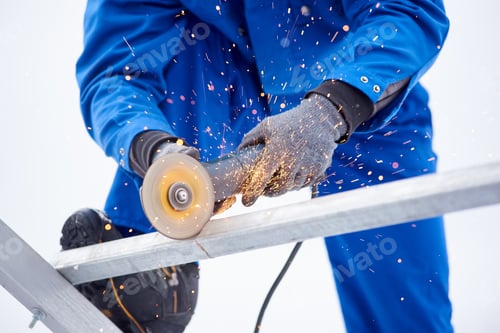 Preview: Professional constructionist cutting steel outdoors