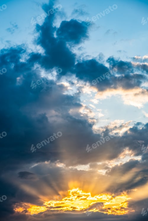 Preview: Dramatic sunset sky, light from heaven. Cumulus stormy clouds in summer