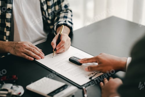 Preview: Portrait of a car sales contract signing, a broker advising a client on signing or refinancing a car